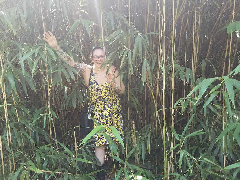 Marie D'Angelo walks out of a bamboo forest